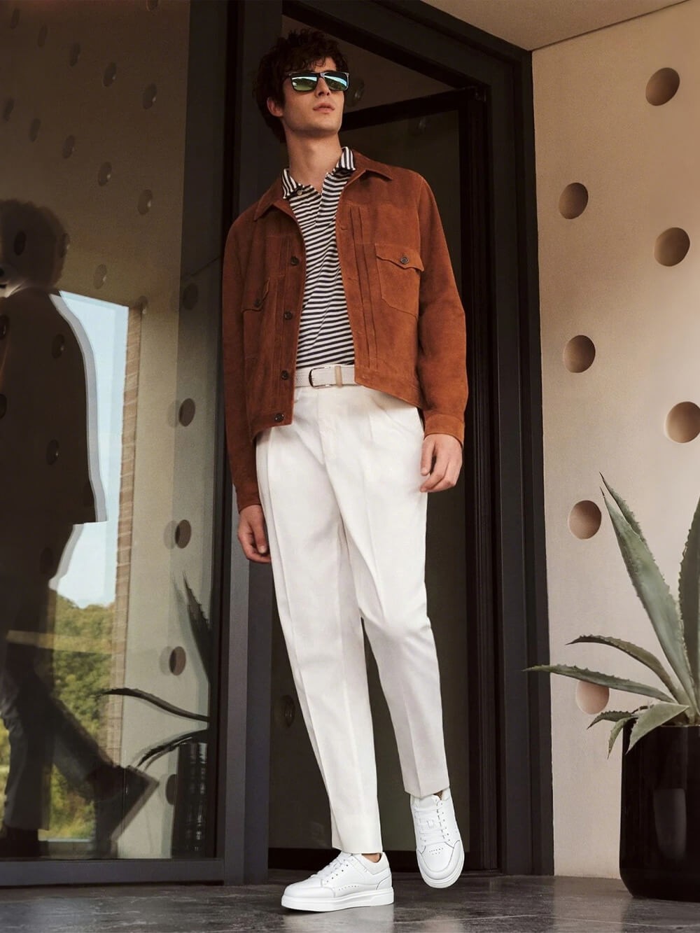a confident man in elevator sneakers