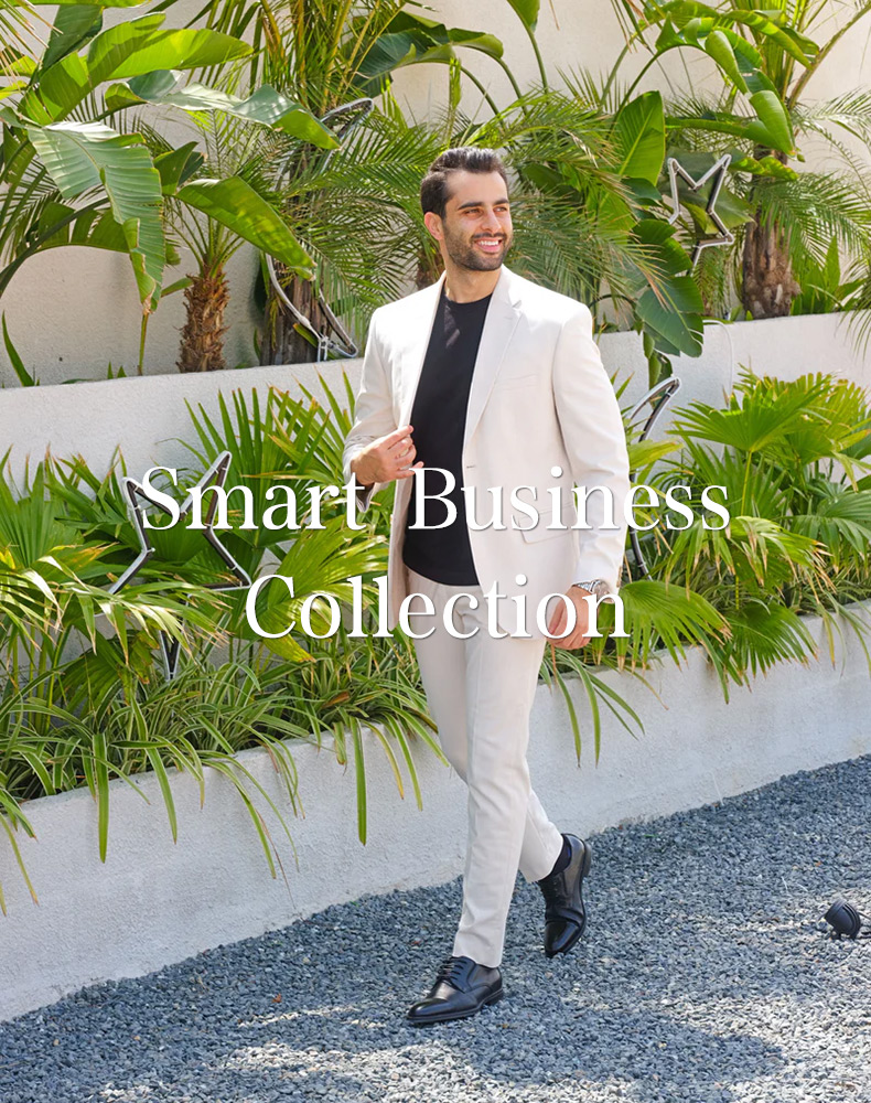 Man in a light suit wearing black elevator dress shoes, business style in Australia