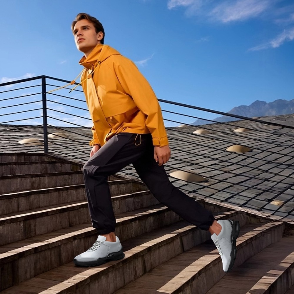 Model wearing grey leather hiking-style elevator shoes for light trails and outdoor adventures