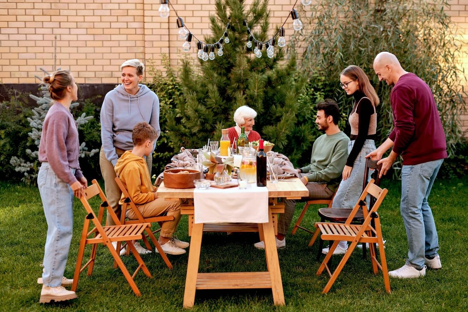 Family and friends enjoying a backyard BBQ during Labour Day Weekend in Canada