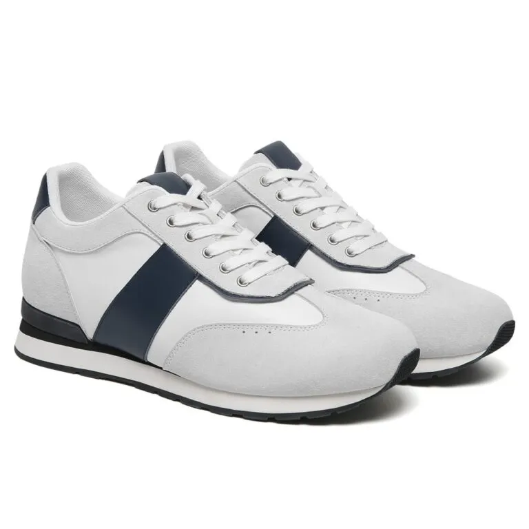 Stylish white and navy blue contrast sneakers with invisible lift, trendy men's elevator footwear for 2026.